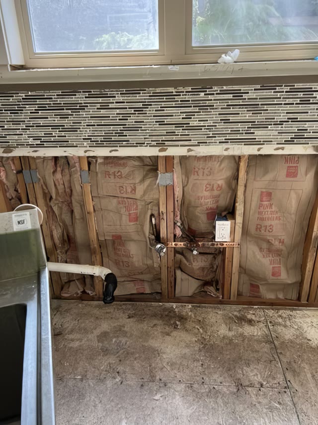 Original kitchen wall with windows and mosaic backsplash